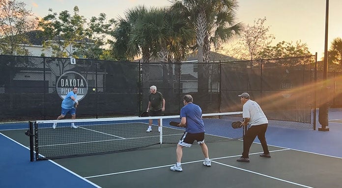 4 people playing tennis