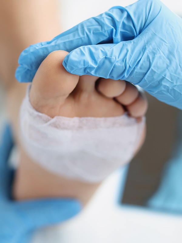 Doctor examined the patient's foot with a patch