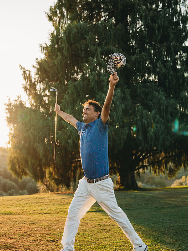 Professional golfer celebrating hole-in-one